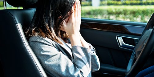 Sad businesswoman driver sitting in car