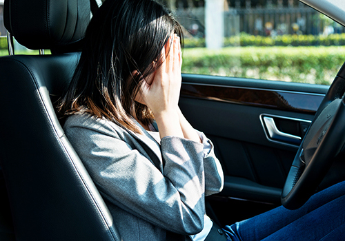 Sad businesswoman driver sitting in car