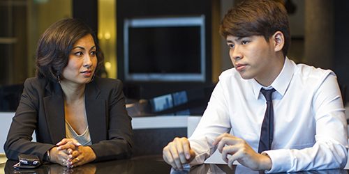 Asian Business People in conversation